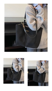 Macro detail of black matte leather tote bag with elegant gold hardware and strap