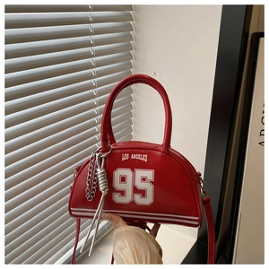 Detail of red PU crossbody bag with white Los Angeles 95 print and silver chain link