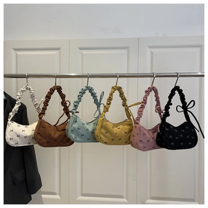 Corduroy shoulder bags in various colors featuring bow patterns and ruched handles