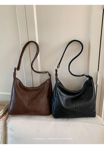 Detail view showing textured synthetic leather and vertical stitching on retro tote bags