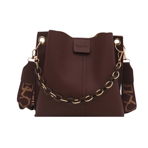 Dark brown leather bucket bag with litchi texture, gold hardware, and dual shoulder straps