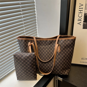 Detail view of large capacity tote bag with matching zipper pouch in brown pattern