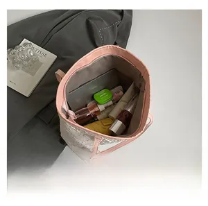 Top-down view of spacious tote bag interior showing pink straps and large storage capacity