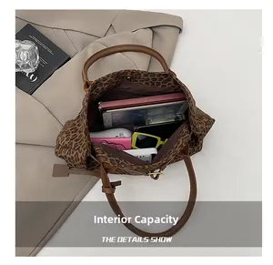 Detailed top view of large leopard print tote bag interior showing ample storage space