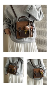 Detail of vintage brown patchwork backpack with metal buckles and plush bear charm