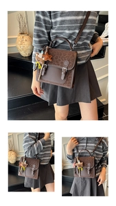Detailed view of leopard print crossbody bag with bear charm and vintage buckles