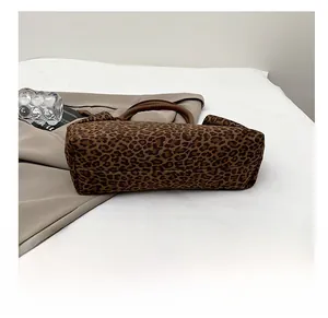Detailed base view of the leopard print tote bag showing the wide wear-resistant bottom