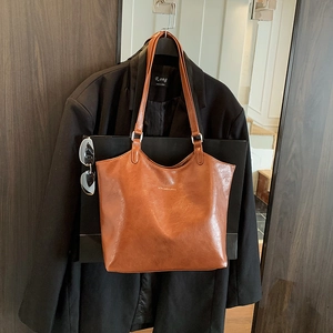 Brown oil wax leather tote bag for women with large capacity and polished finish