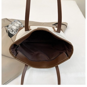 Top view of large canvas tote bag showing dark brown interior lining and zipper pocket