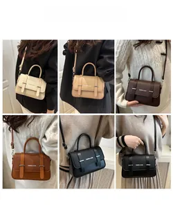 Detailed view of women's tote bags in multiple colors featuring pebbled leather texture