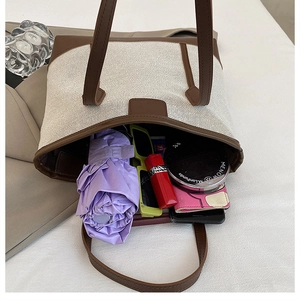 Top view of large tote bag showing interior storage for daily essentials and leather details