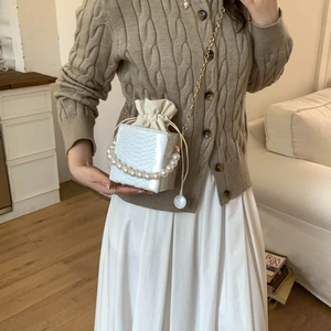 Elegant white snake-texture bucket bag with pearl handle and golden chain strap