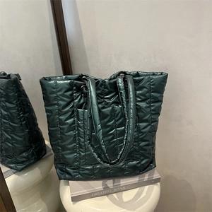 Quilted tote bag in dark green shiny nylon with large capacity and shoulder straps