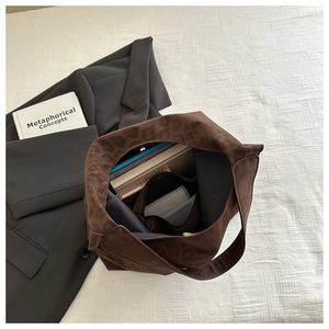 Detailed interior view of a large leopard print tote bag with ample space for tablet and books
