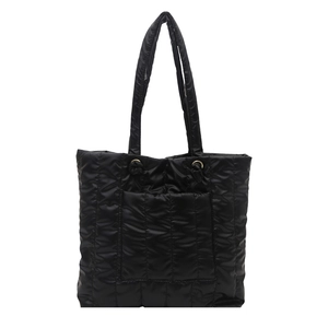 Large black quilted tote bag with padded nylon texture and elegant shoulder straps