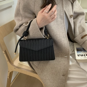 Fashionable black woven envelope handbag with knot handle and golden hardware for women