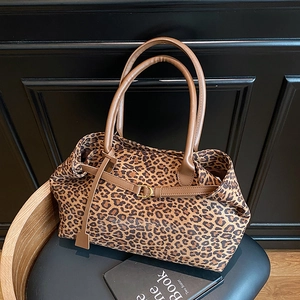 Leopard print tote bag with brown leather handles and buckle detail for autumn 2025