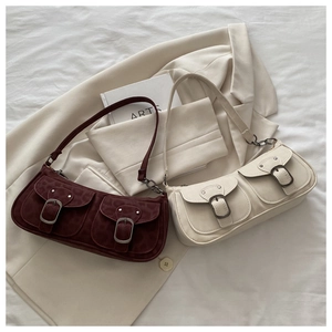 Detail of vintage underarm bags in burgundy leopard print and cream white with double pockets
