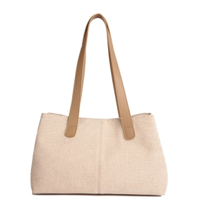 Women's woven straw tote bag with brown PU leather handles and rustic canvas texture