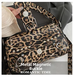 Close-up of leopard print shoulder bag with silver studs and magnetic hardware closure