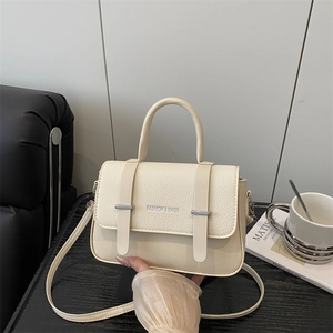 Elegant beige leather crossbody bag with top handle and detachable strap for women