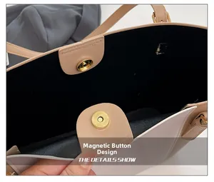 Détail du fermoir magnétique sur le sac fourre-tout beige avec doublure intérieure noire