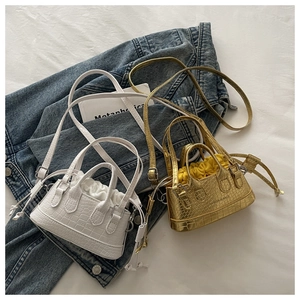 Mini crocodile pattern handbags in white and metallic gold with drawstring inner pouches