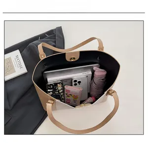 Vue de dessus du grand sac cabas montrant la capacité pour ordinateur et accessoires