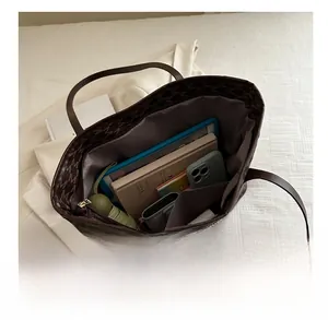 Interior view showing the large capacity of this printed tote bag for books and tablets