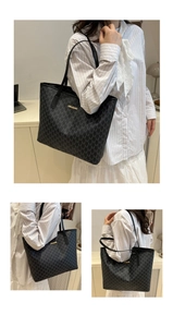Detail of large tote bag featuring stylish M-letter jacquard and golden logo plate