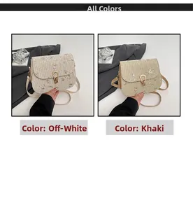 Detail view of woven straw crossbody bags with floral embroidery and gold hardware