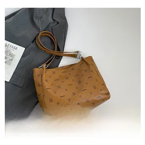 Detailed overhead view of the LNBOE monogram tote bag with brown leather strap