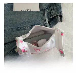 Detail view of floral canvas tote bag interior showing daily essentials storage capacity