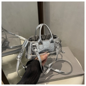 Silver crocodile texture handbag showing inner lining and metal logo detail