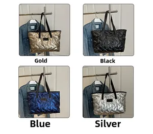 Quilted metallic tote bags displayed in gold, black, blue and silver colors