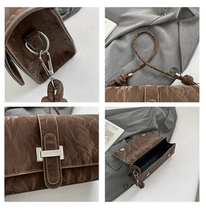Detail view of brown PU leather texture, silver clasp, and knotted shoulder strap