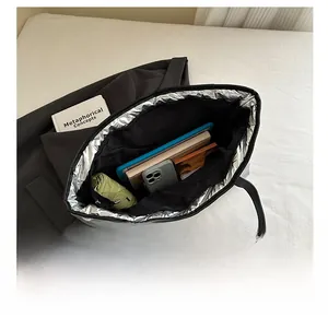 Internal view of silver quilted tote bag showing spacious storage for daily essentials