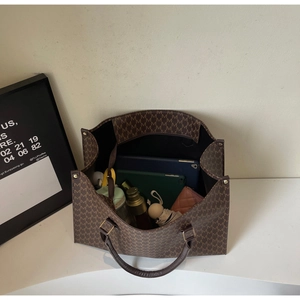 Detailed internal view of large capacity tote bag showing daily essentials storage