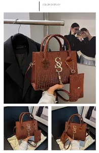 Brown crocodile texture handbag with gold S hardware and matching small card holder