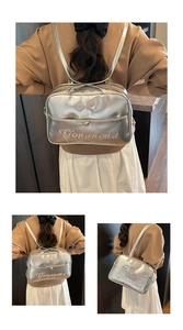 Detailed views of a silver metallic backpack with bow and Gonanond embroidery