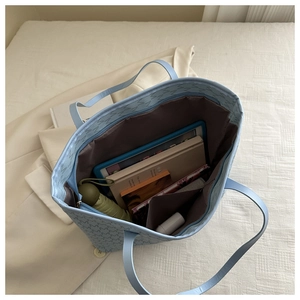 Top view of large tote bag interior showing ample space for tablets and books