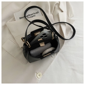Internal view of black pebble leather crossbody bag showing spacious storage for essentials