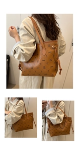 Close-up of vintage printed tote bag with LNBOE pattern and brown faux leather details