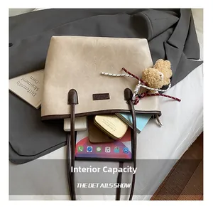 Interior view showing large capacity for tablet and cosmetics in beige tote bag