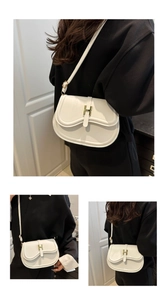 Close-up of cream square crossbody bag with gold H-shaped clasp and adjustable strap