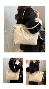 Detail of beige tote bag featuring rabbit monogram patterns and side drawstring tassels