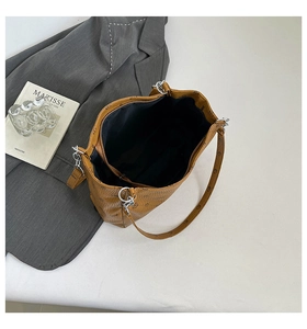 Top-down view of spacious tote bag interior featuring secure zipper pocket and metal hardware