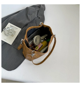 Detail showing the large interior capacity of this brown vintage pattern bucket bag