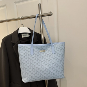 Light blue tote bag with letter print pattern and gold logo for office commute