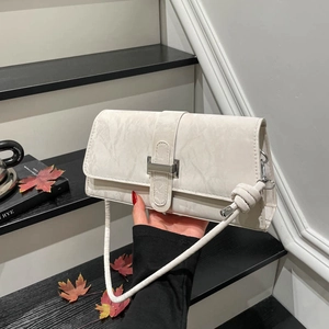 Minimalist beige shoulder bag with marble texture and silver buckle for women in autumn